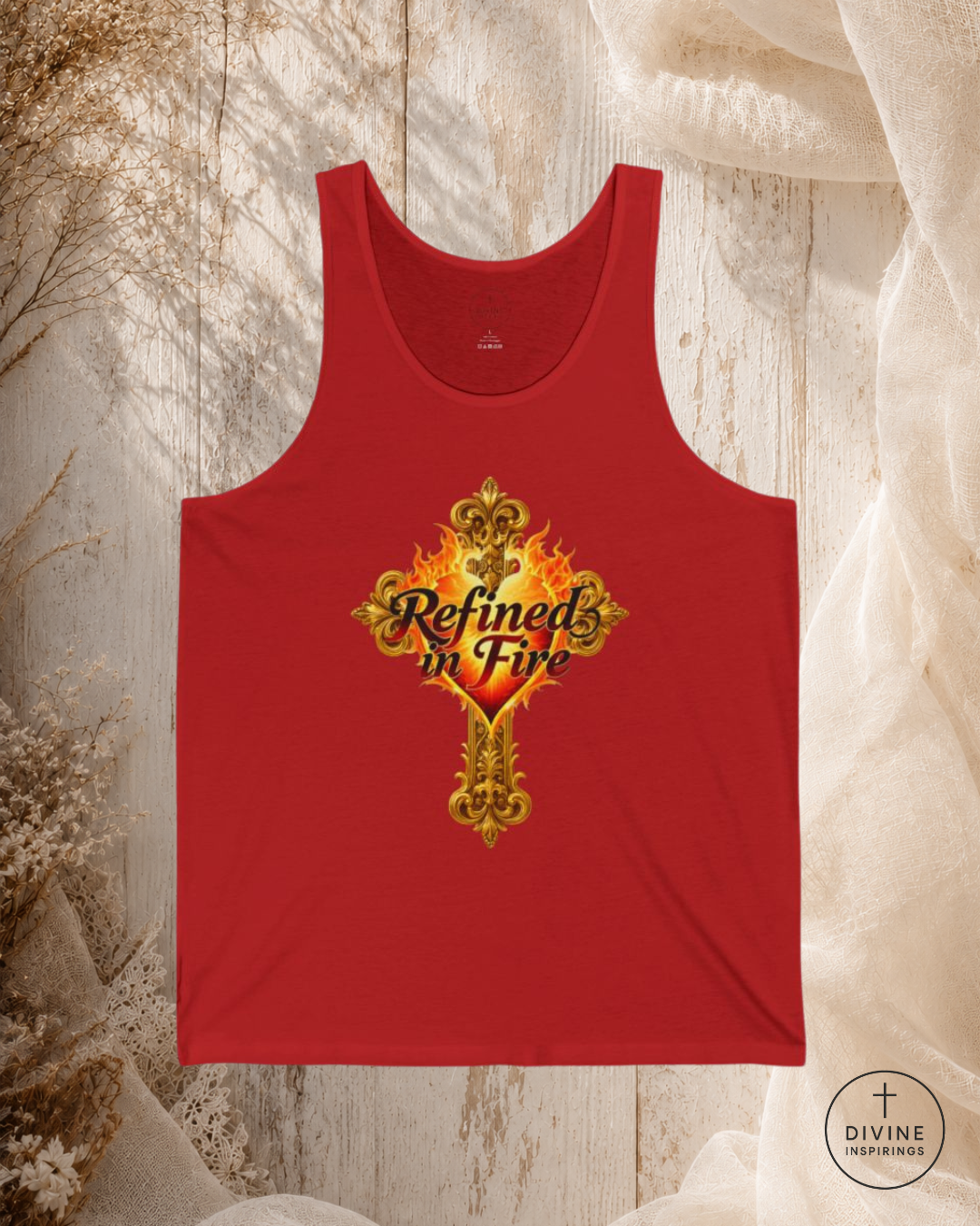Red tank top with 'Refined in Fire' design on a textured surface