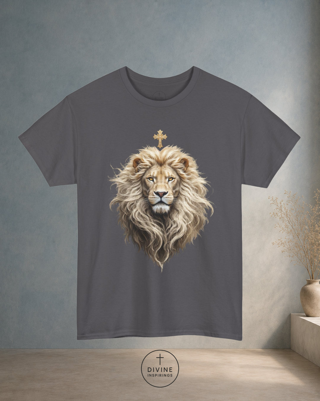 Gray t-shirt with a lion graphic and cross on a neutral background