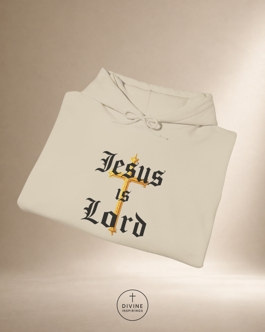 Folded hoodie with 'Jesus is Lord' text on a beige background