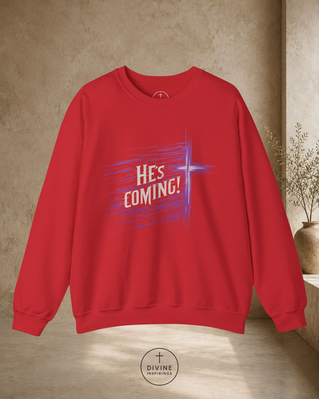 Red sweatshirt with 'He's Coming!' text on a beige background