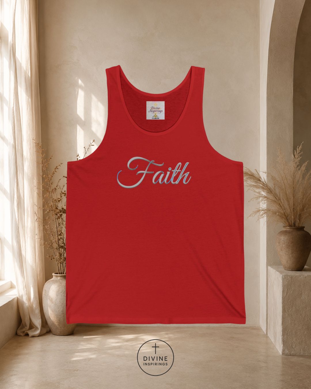 Red tank top with 'Faith' printed on it, displayed in a room with natural light.