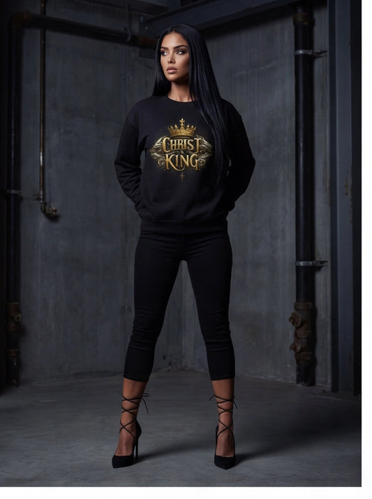 Person wearing a black hoodie with 'Christ King' design in a dark setting