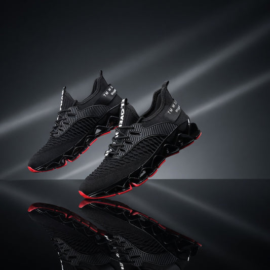 Black athletic shoes with red accents on a reflective black surface with light effects