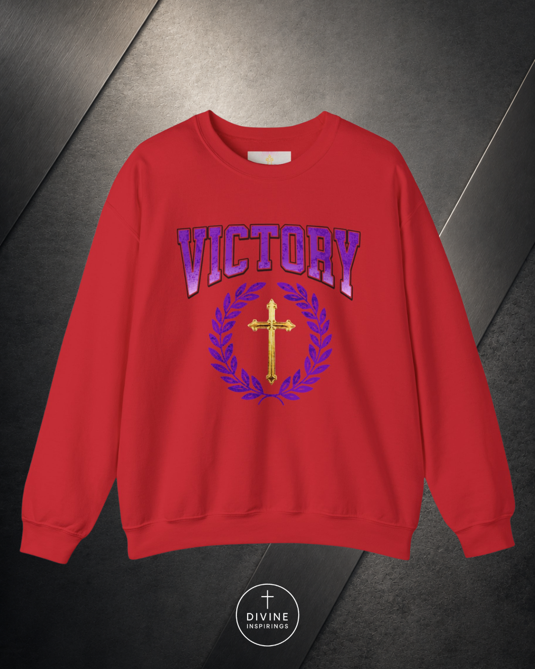 Red sweatshirt with 'VICTORY' and cross design on a dark background
