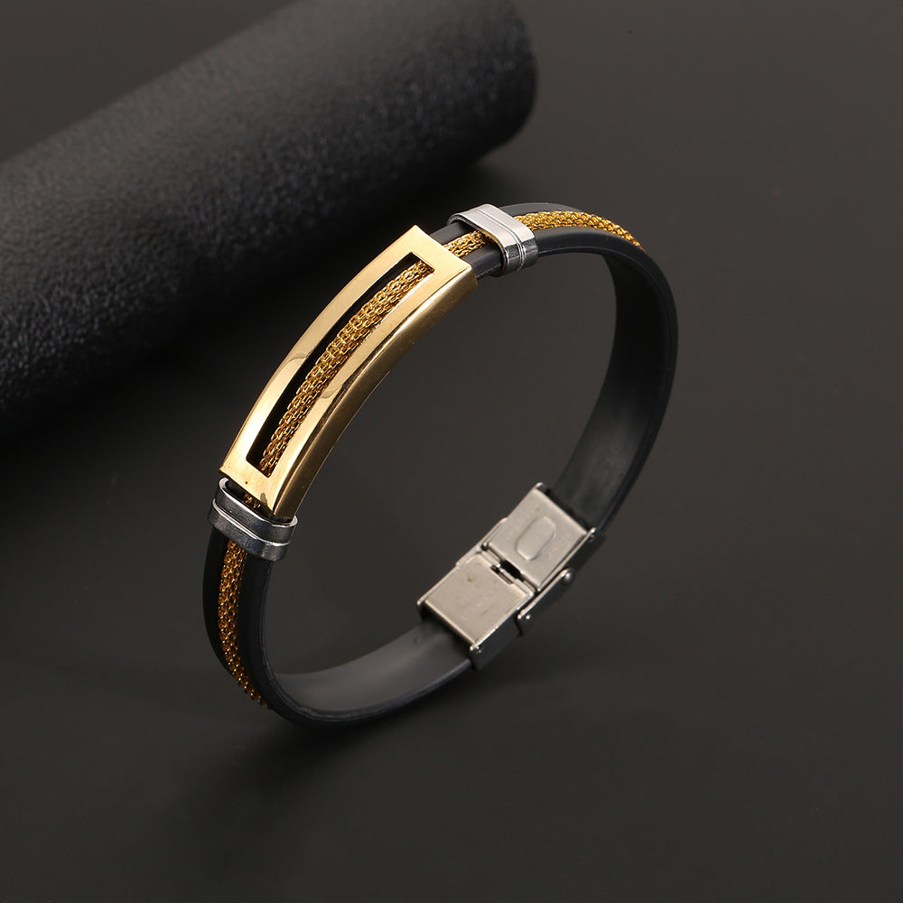 Bracelet with gold, silver, and black design on a dark background