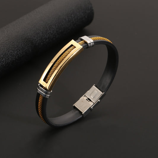 Bracelet with gold, silver, and black design on a dark background