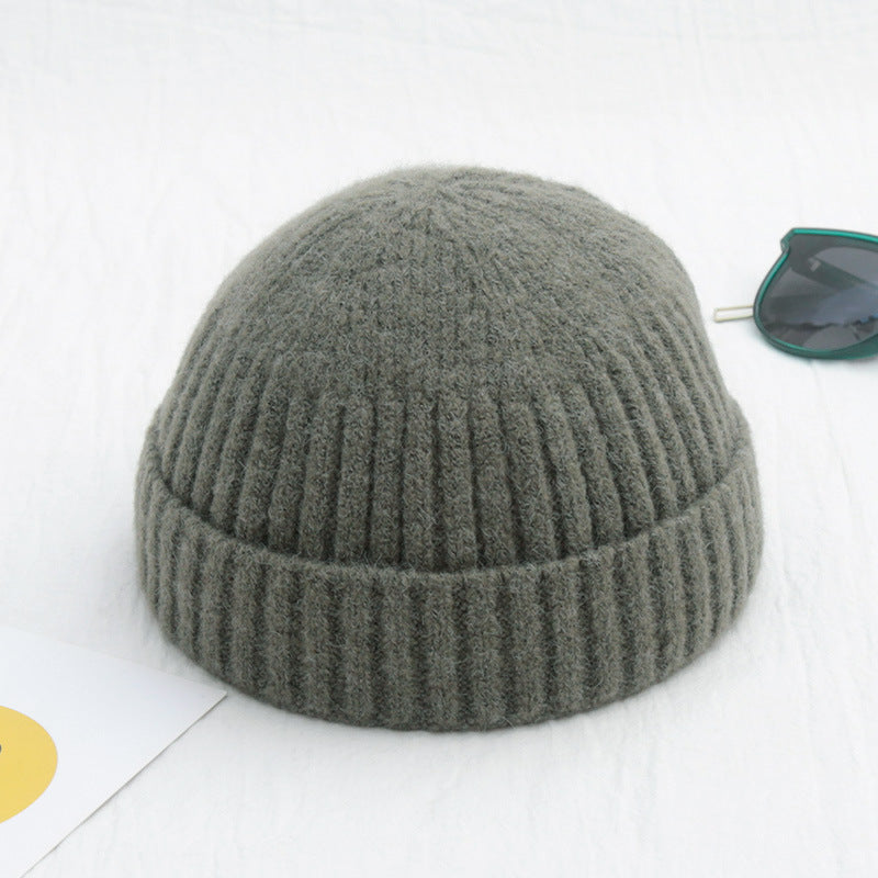 Gray knit beanie on a white background