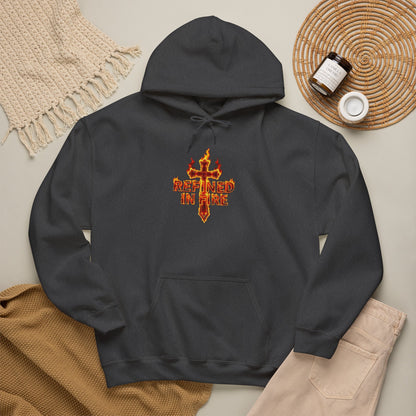 Black hoodie with 'Refined in Fire' design on a neutral background