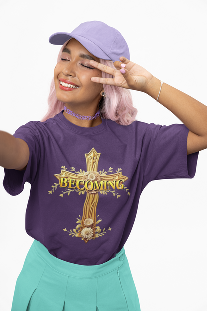 Becoming Women’s Faith Tee – Gold Cross Edition (Light Lettering, 1 Corinthians 15:49)