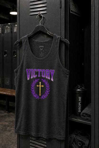 Black tank top with 'Victory' and cross design hanging in a locker room.