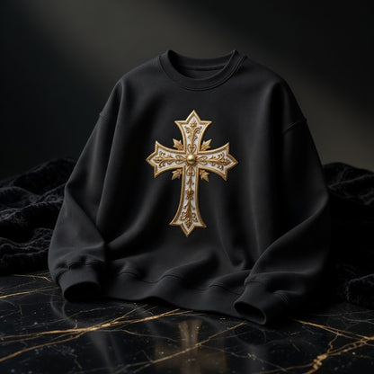 Black sweatshirt with a gold cross design on a dark marble surface