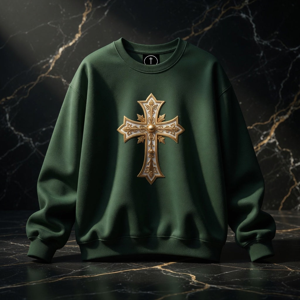 Green sweatshirt with a gold cross design on a dark marble background
