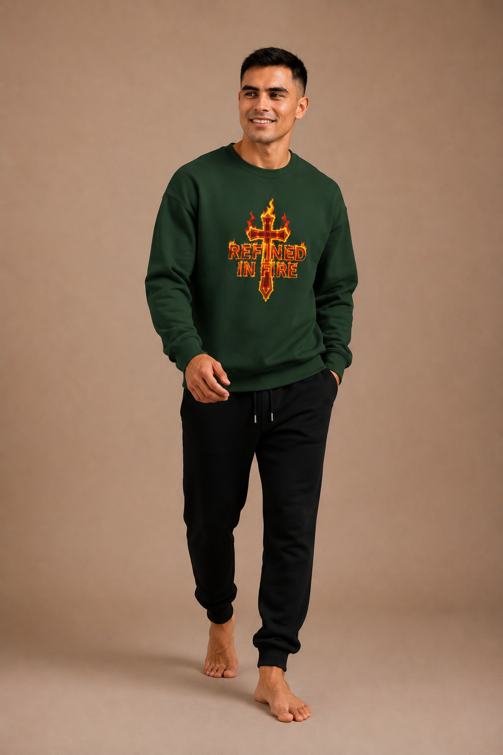 Man wearing a green sweatshirt with a colorful graphic design on a beige background