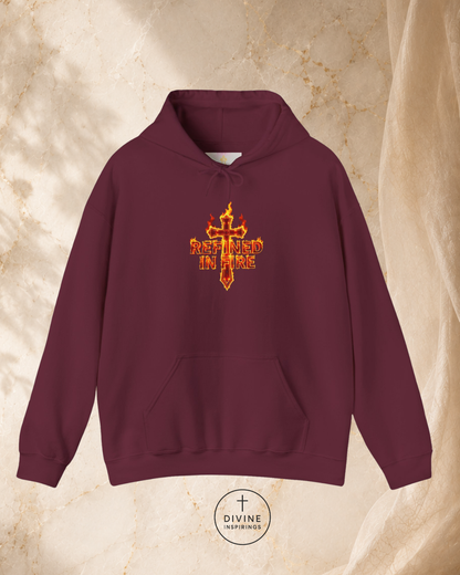 Maroon hoodie with a red and gold cross design on a beige background