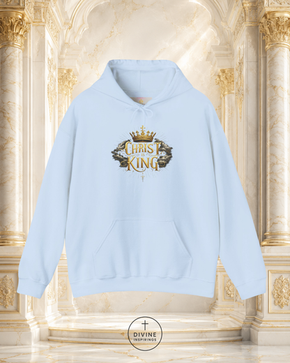Light blue hoodie with 'Christ King' design on a decorative background
