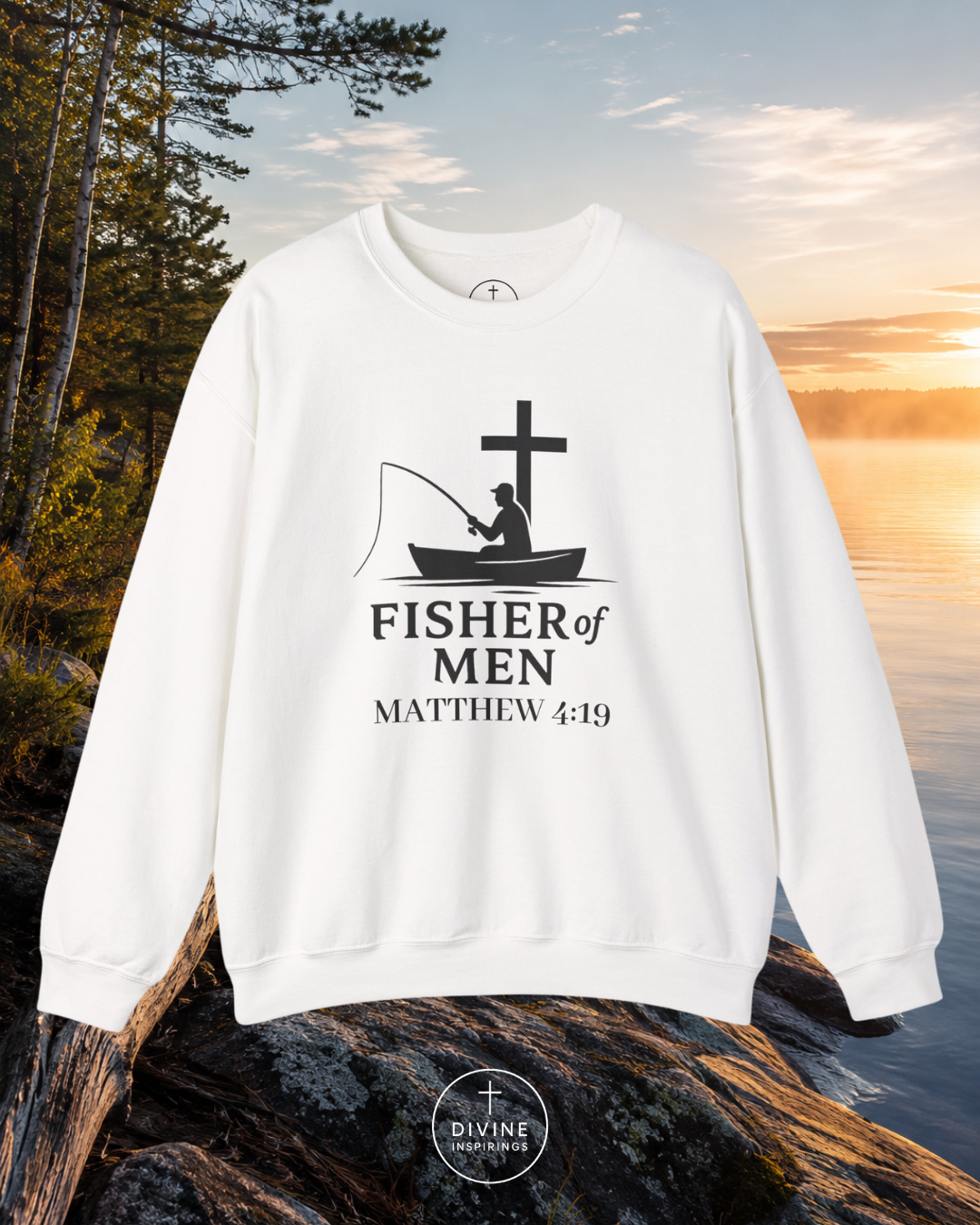 White sweatshirt with 'Fisher of Men' design on a rock by a lake with sunset