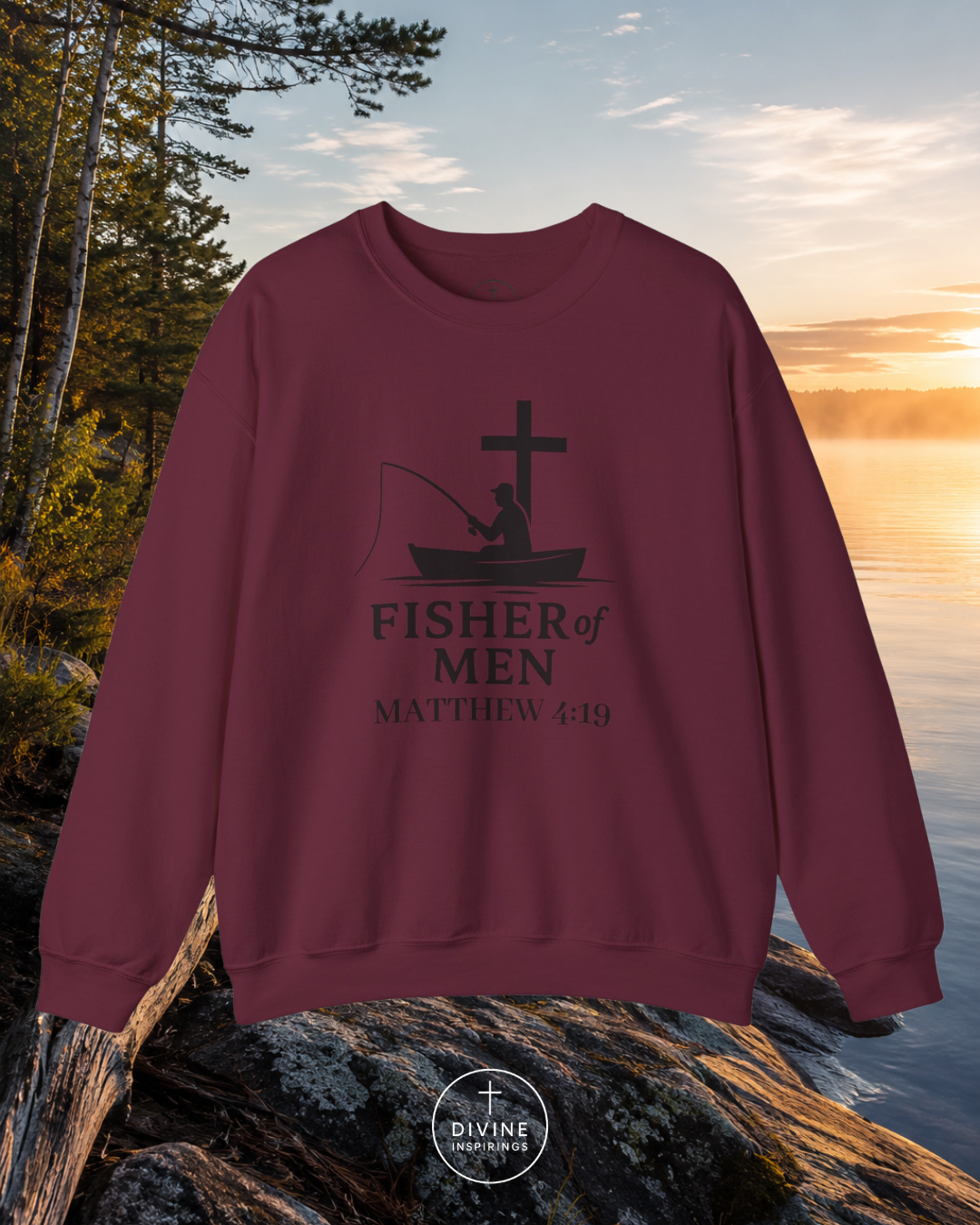 Maroon sweatshirt with 'Fisher of Men' design by a lake at sunset