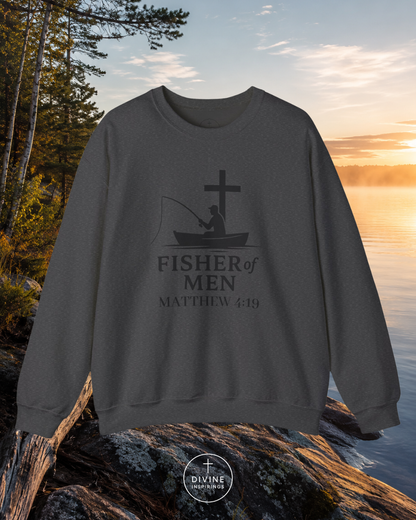 Dark gray sweatshirt with 'Fisher of Men' design by a lake at sunset