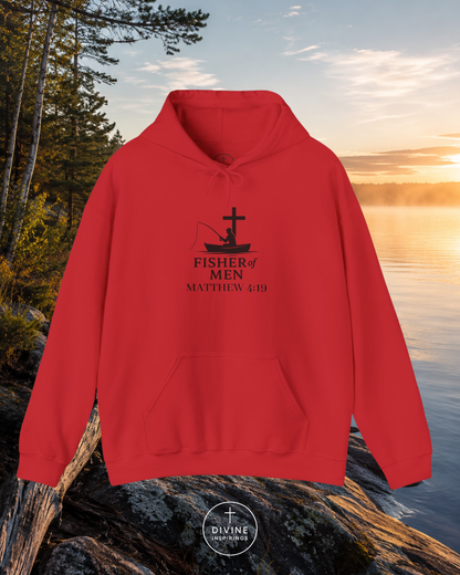 Red hoodie with 'Fisher of Men' design on a rock by a lake at sunset