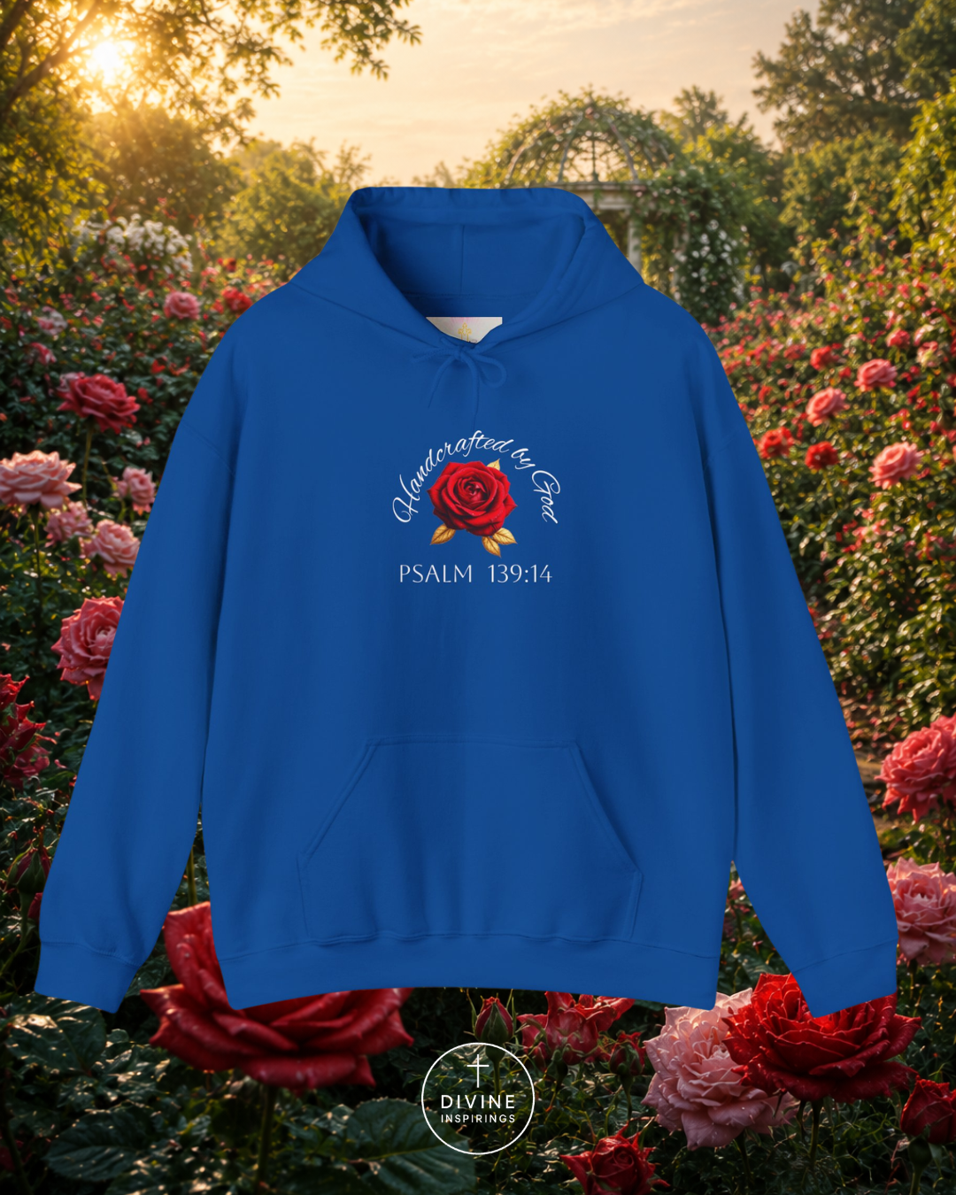Blue hoodie with a red rose design and text in a garden setting