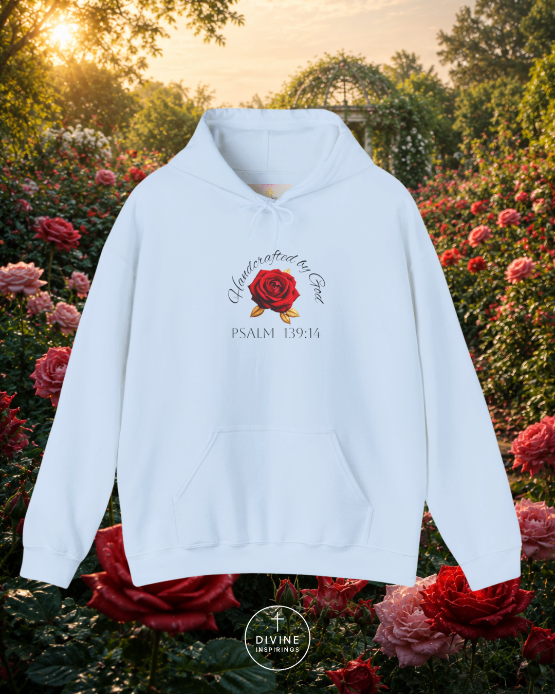 White hoodie with a rose design and text in a garden setting