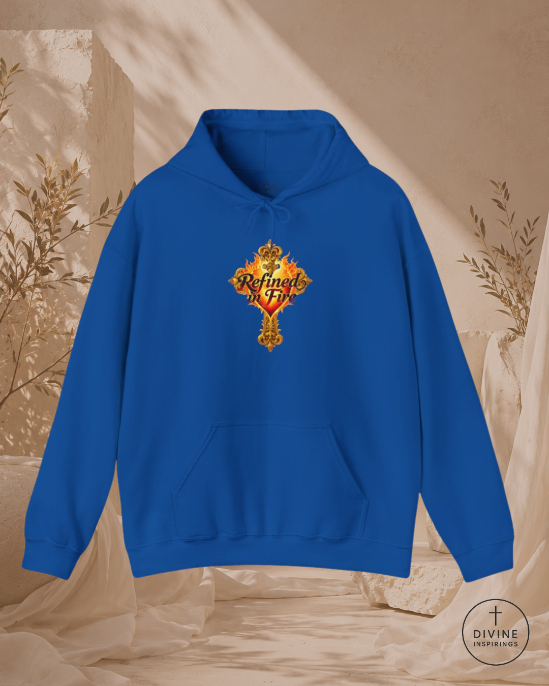 Blue hoodie with a decorative emblem on a beige background