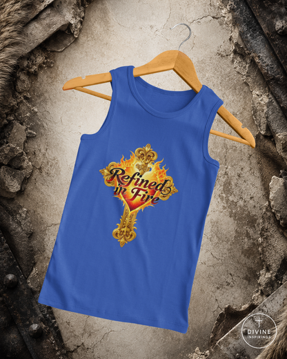 Blue tank top with 'Refined in Fire' design on a hanger against a textured wall background.