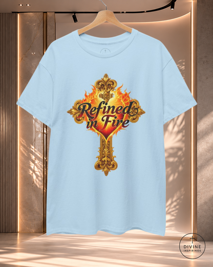 Light blue t-shirt with 'Refined in Fire' design on a hanger against a neutral background