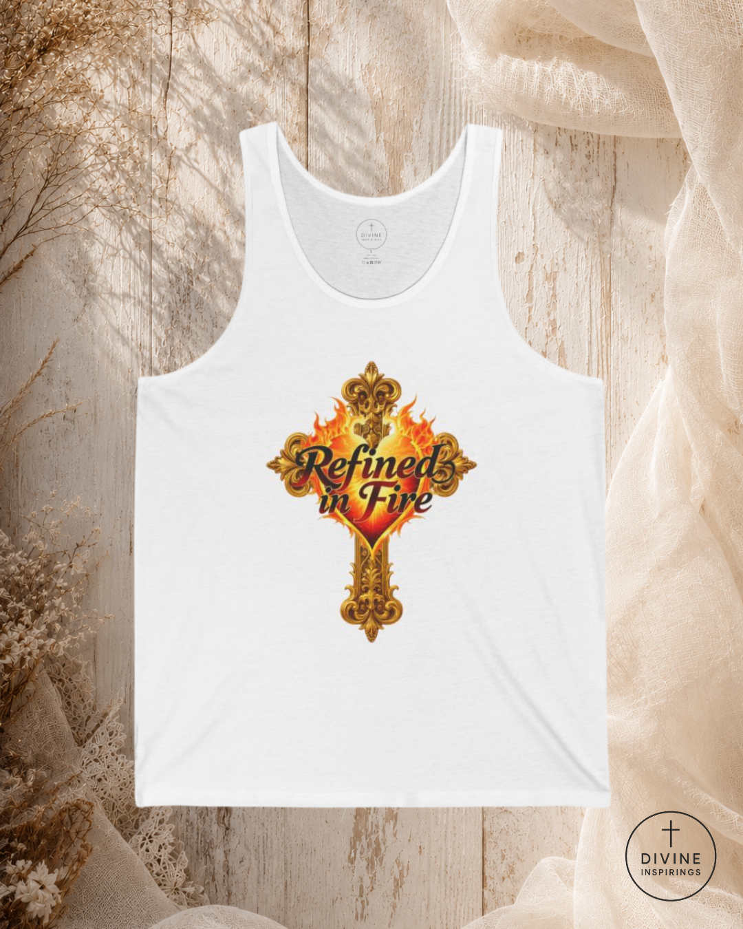 White tank top with 'Refined in Fire' design on a textured surface