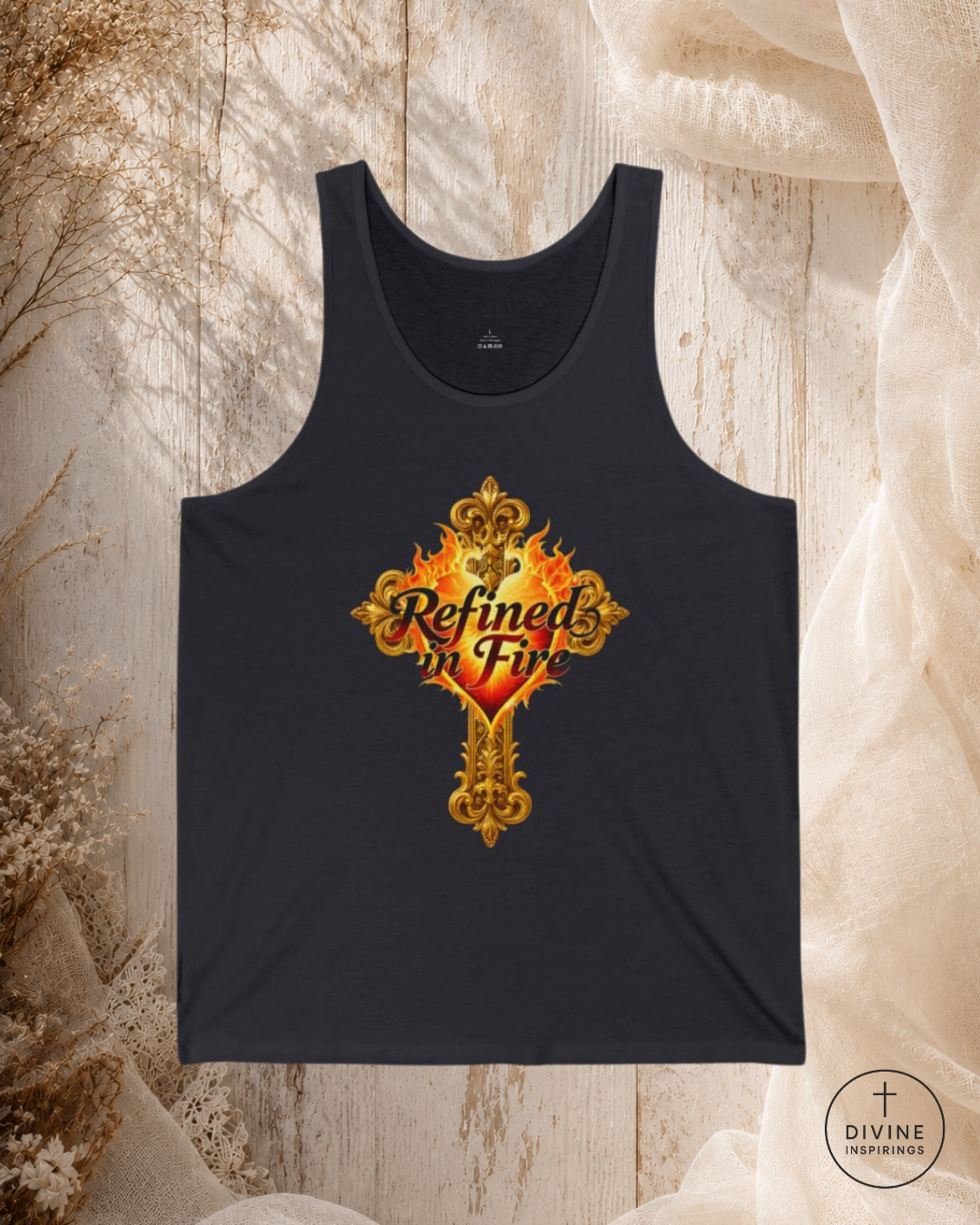 Black tank top with 'Refined in Fire' design on a textured beige background