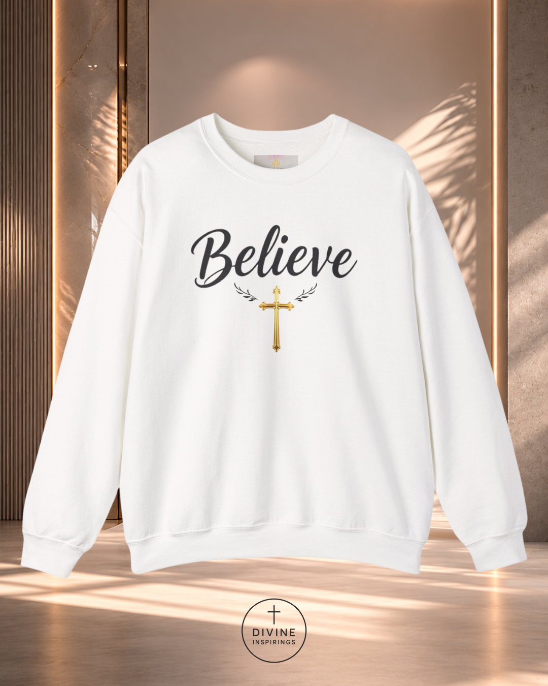 White sweatshirt with 'Believe' and a cross design on a wooden background