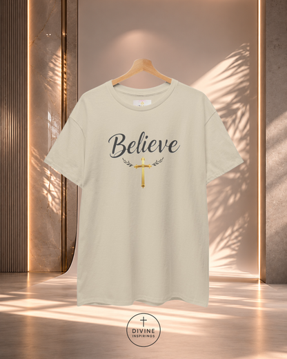 Beige t-shirt with 'Believe' and cross design on a wooden background
