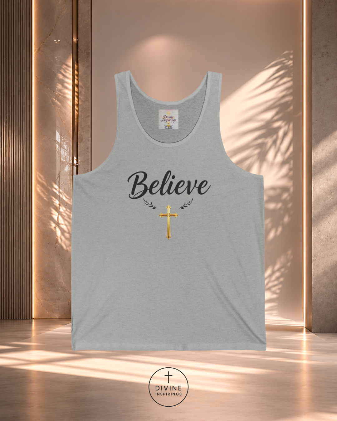 Gray tank top with 'Believe' and cross design on a wooden background