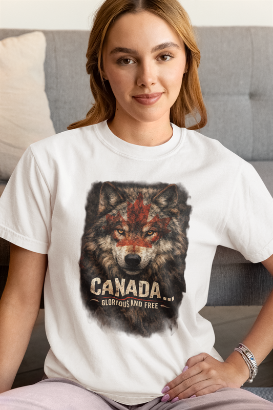 Woman wearing a white t-shirt with a wolf graphic and 'Canada' text, sitting on a couch.