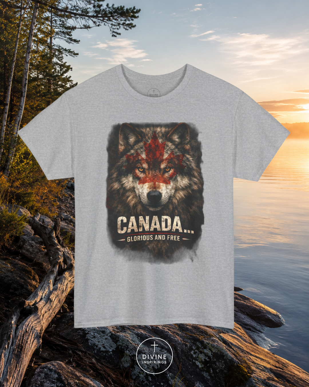 Gray t-shirt with a wolf graphic and 'Canada' text on rocks by a lake at sunset.