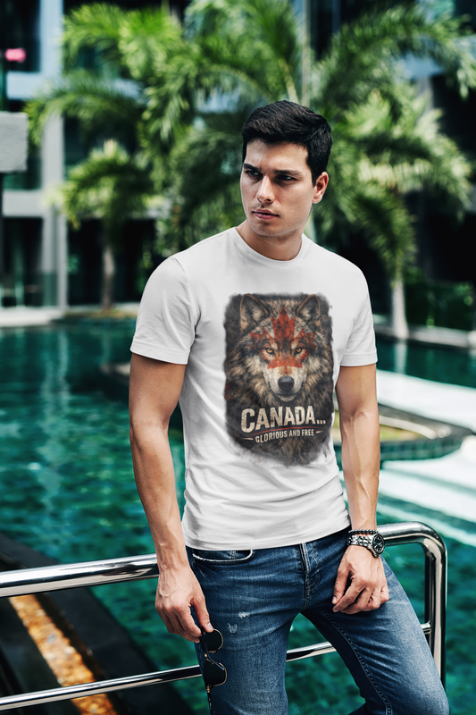 Man wearing a white t-shirt with a wolf graphic and 'Canada' text, standing by a pool with greenery.