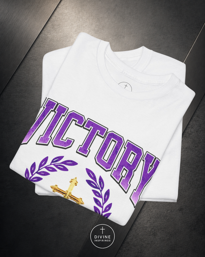 Pink sweatshirt with 'VICTORY' printed in purple on a dark surface