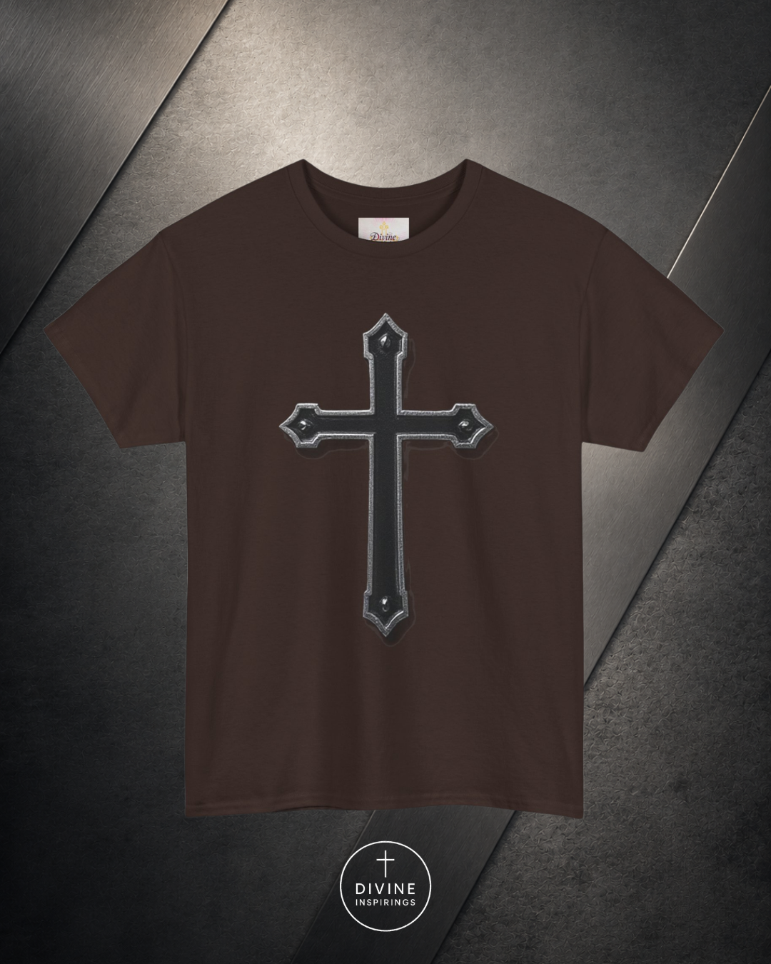 Brown t-shirt with a black cross design on a dark surface