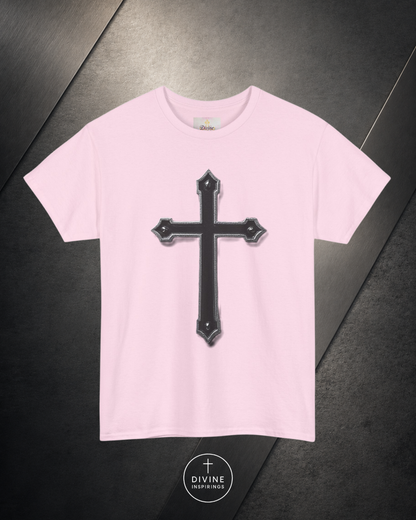 Pink t-shirt with a black cross design on a dark surface