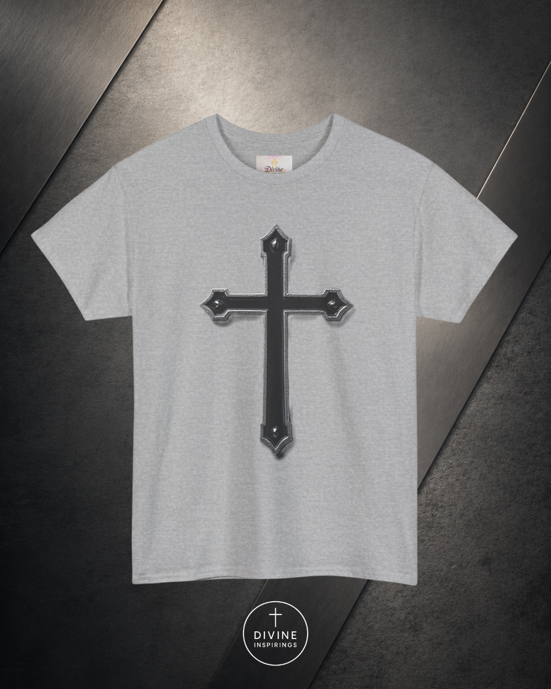 Gray t-shirt with a black cross design on a dark surface