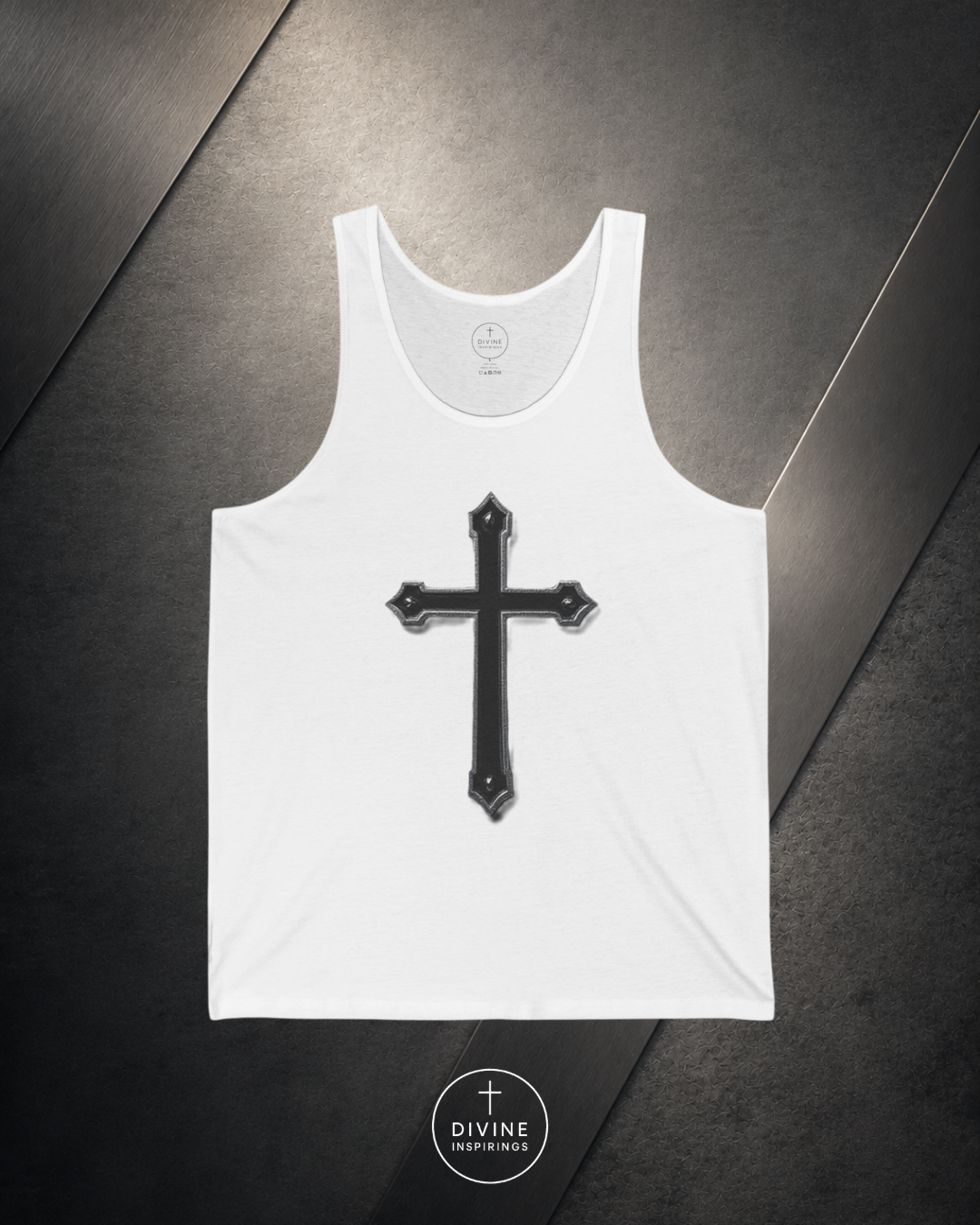 White tank top with a black cross design on a dark surface, featuring the brand 'Divine Inspirings'.