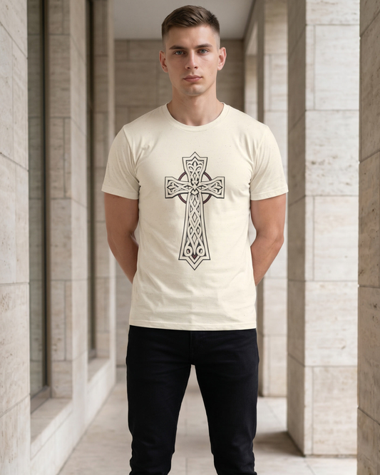 Man wearing a white t-shirt with a black cross design in an architectural setting