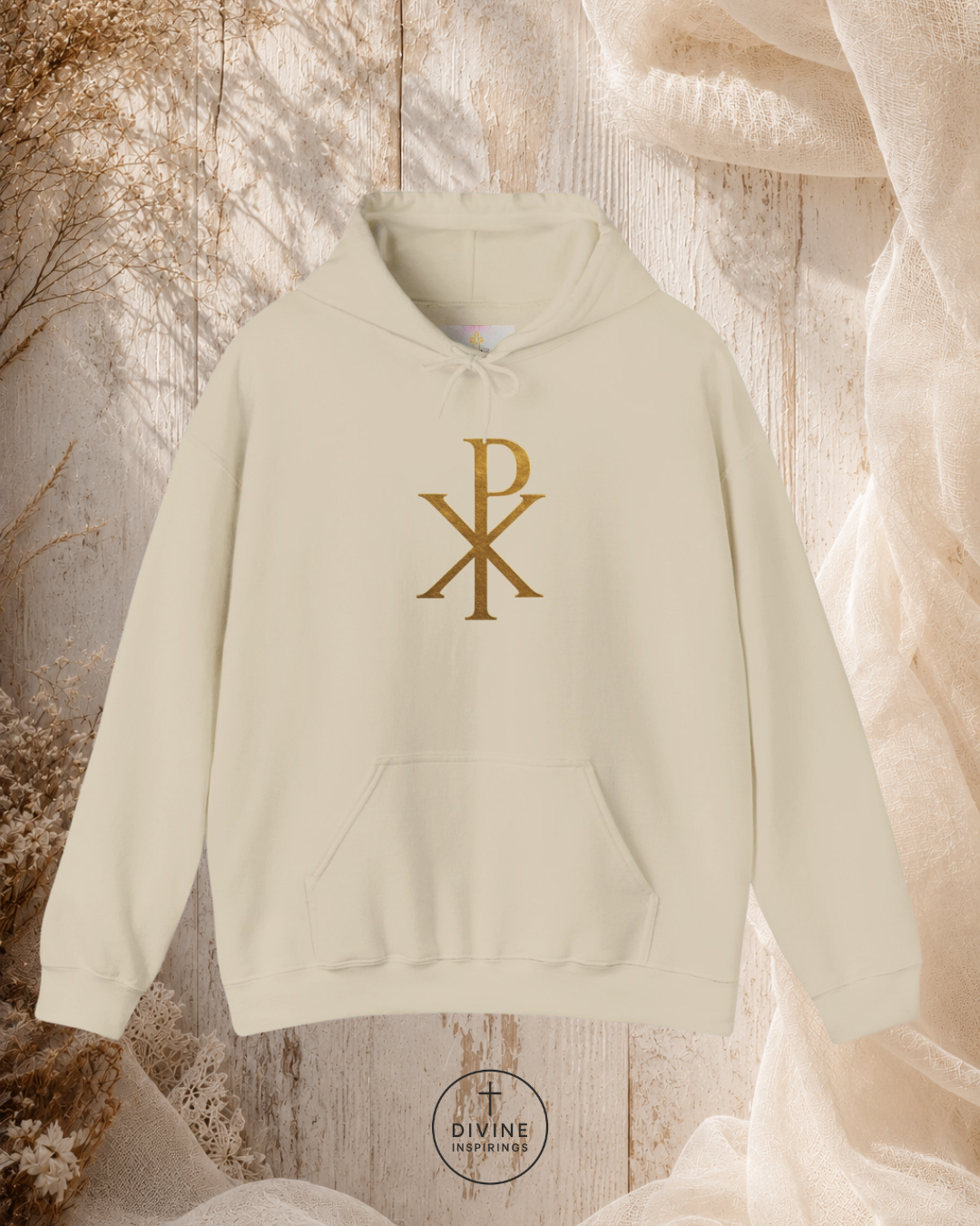 Beige hoodie with gold symbol on a textured beige background