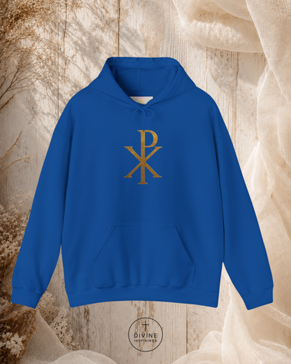 Blue hoodie with a gold symbol on a textured beige background