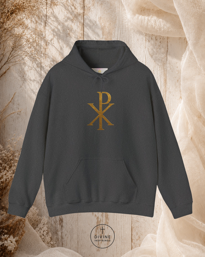 Maroon hoodie with gold symbol on a textured beige background