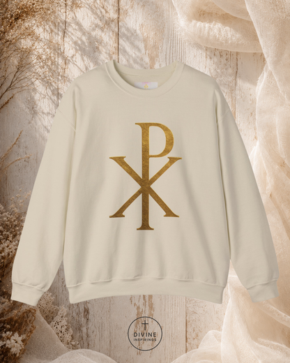 Beige sweatshirt with gold symbol on a textured beige background