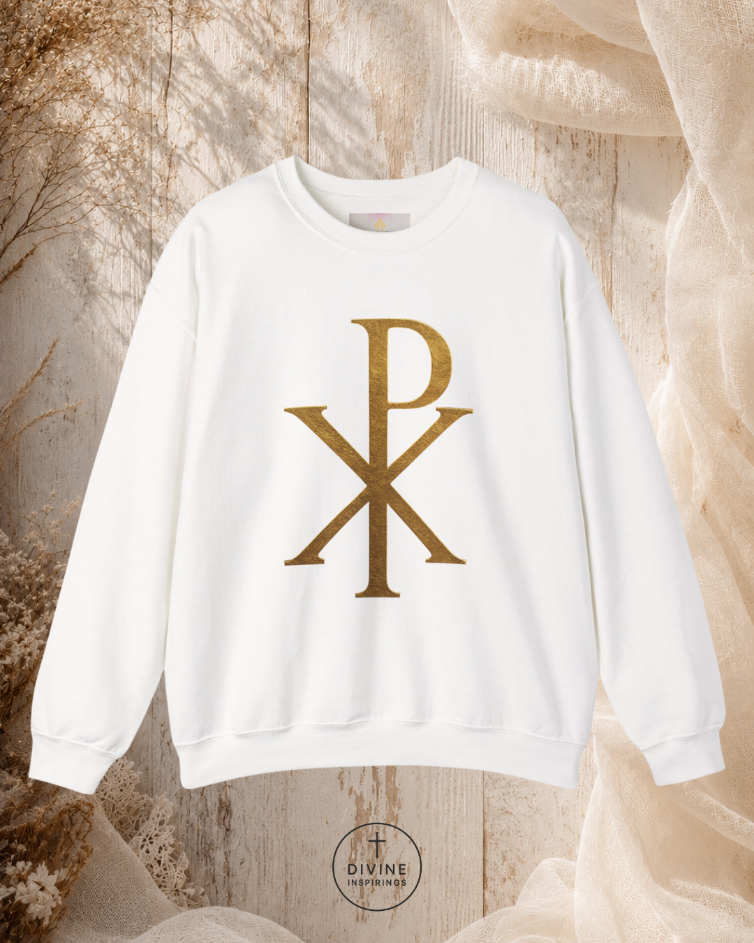 White sweatshirt with gold symbol on a textured beige background