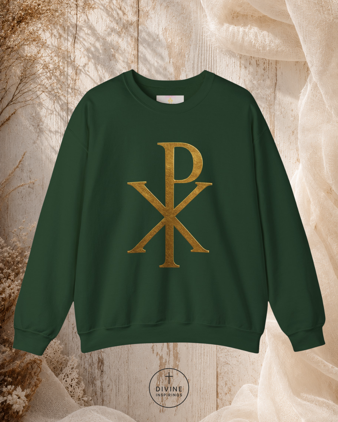 Black sweatshirt with gold symbol on a textured beige background