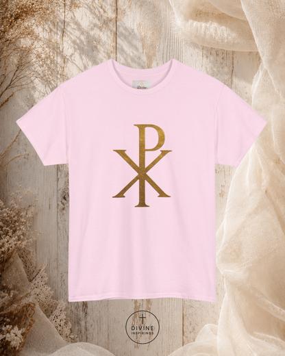 Pink t-shirt with gold symbol on a textured surface