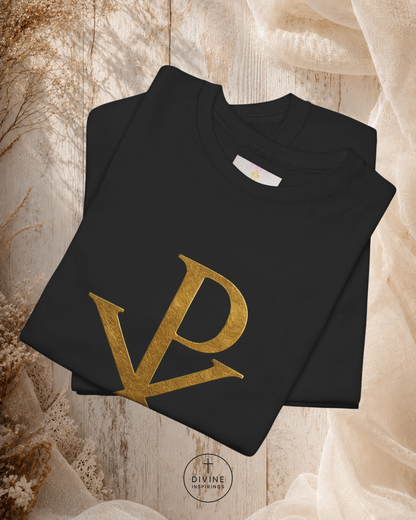Black t-shirt with gold logo on a textured beige background